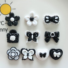Xiaoxiangfeng 黒と白の樹脂アクセサリー花愛の弓 DIY ジュエリーパッチ素材卸売