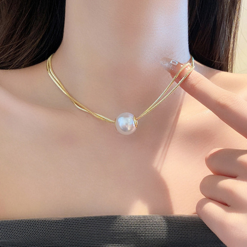 Double-layer stacked pearl titanium steel necklace, fashionable and elegant, versatile clavicle chain for women with elegant niche design.