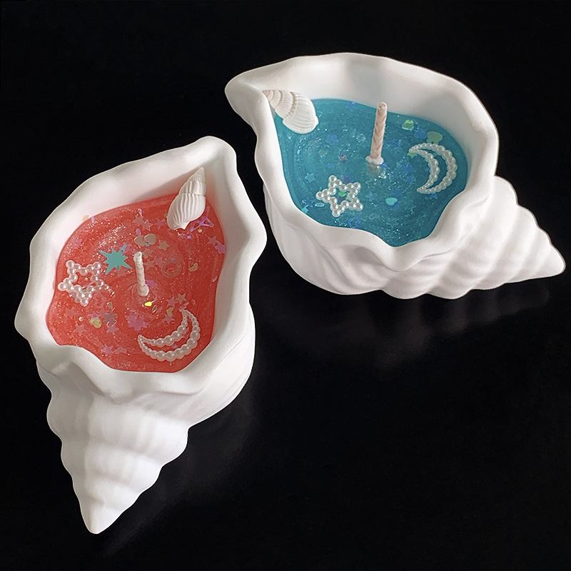 Doftljus formad som snäcka i presentförpackning för stämning_voghion.com