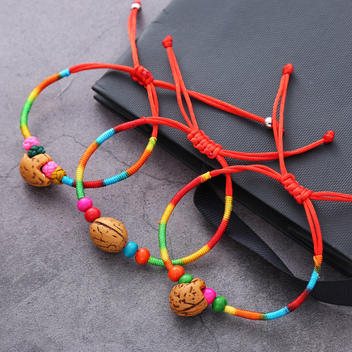 Handmade woven five-colored thread bracelet with five-colored thread and peach kernel red rope for the Dragon Boat Festival, wholesale accessories for the Dragon Boat Festival.