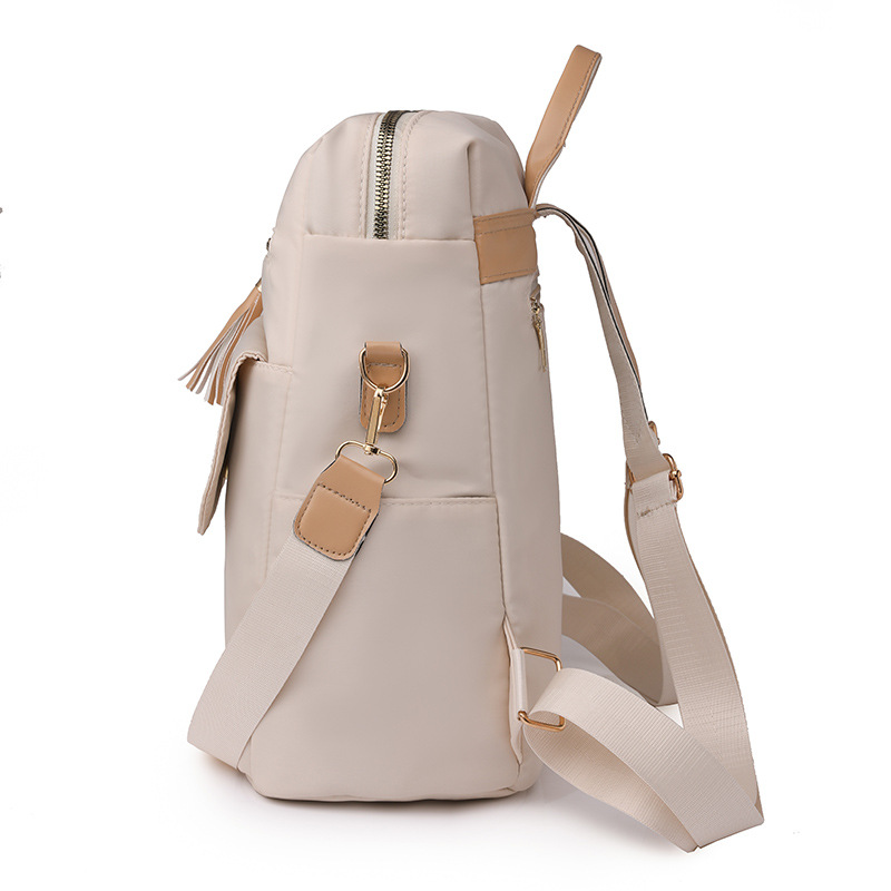 Bolso mujer 2023 nueva mochila casual para mujer con borla de nailon simple color de contraste mochila ligera multifuncional marea