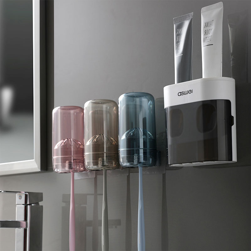 En stock venta al por mayor cepillo de dientes rack Punch-libre montado en la pared hogar Baño creativo automático pasta de dientes exprimidor