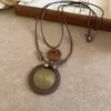Бронзовое ожерелье с рифлёным диском