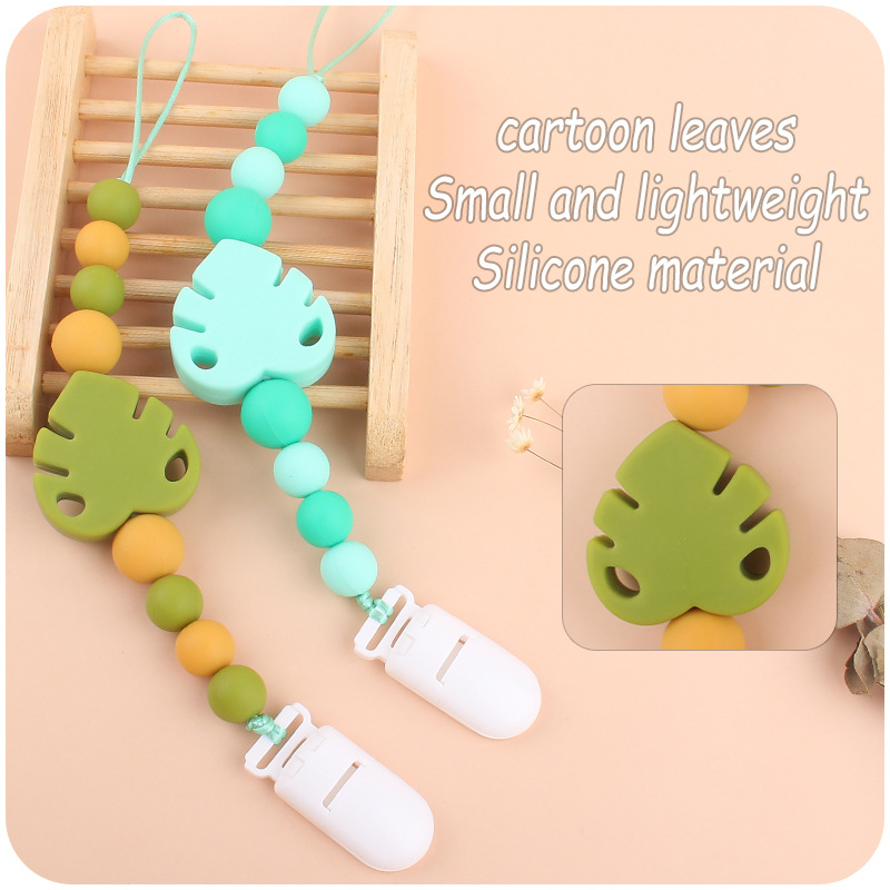 Suministros para bebés chupete cadena creativa bebé dibujos animados hojas silicona mordedura cadena anti-gota molar Nuevo
