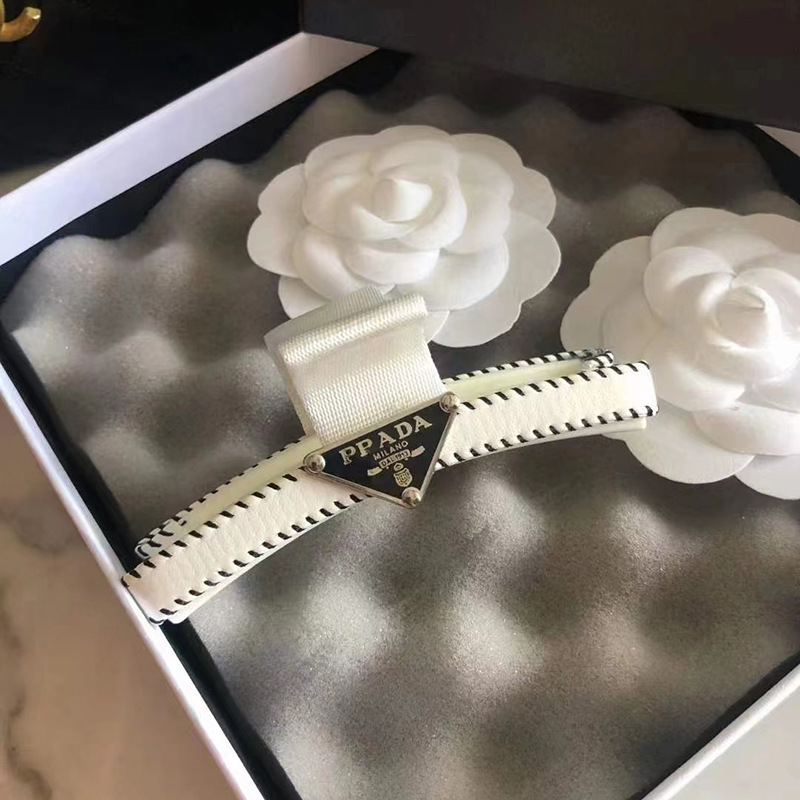 White clip with black label