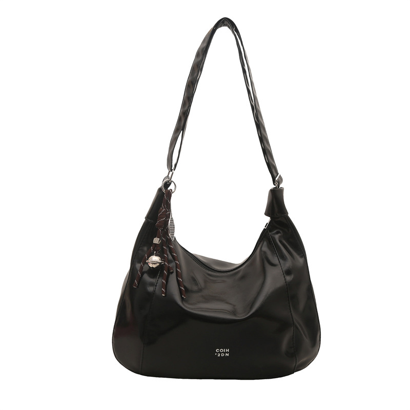 Bolsa de viaje casual de gran capacidad para mujeres 2025 primavera y verano nueva moda versátil hombro de hombro con una sensación relajada bolso