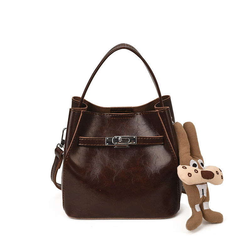 Bolso de viaje bolso de cubo de mano mujer 2025 nuevo otoño invierno alto sentido retro bolso de hombro relajado bolso de mochila