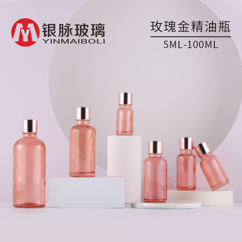 Golden bottle for essential oils contains rose