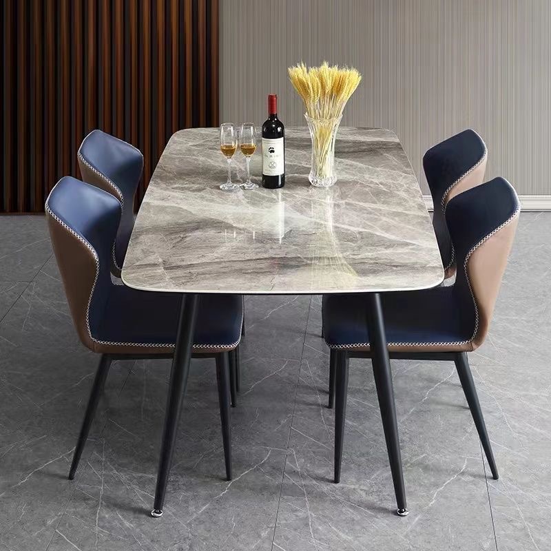 Mesa y silla de comedor de tabla de roca ligera de estilo italiano de lujo, combinación de mesa y silla de comedor de apartamento rectangular moderno y simple.