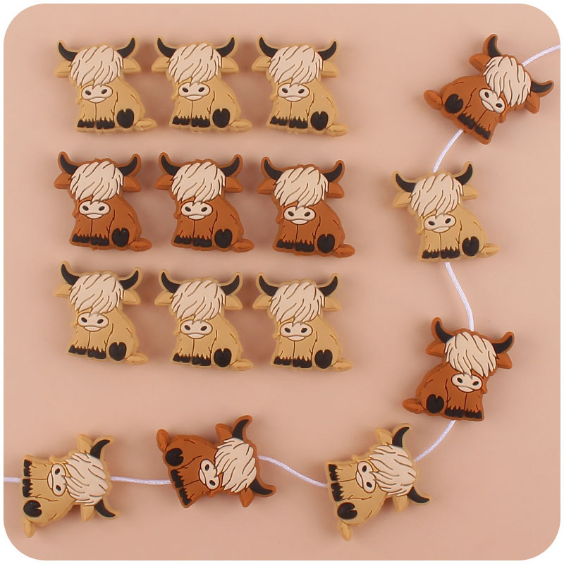 Bebé suministros de dibujos animados de silicona vaca mordedor creativo DIY bebé molar pezón cadena anti-gota cadena accesorios pequeños