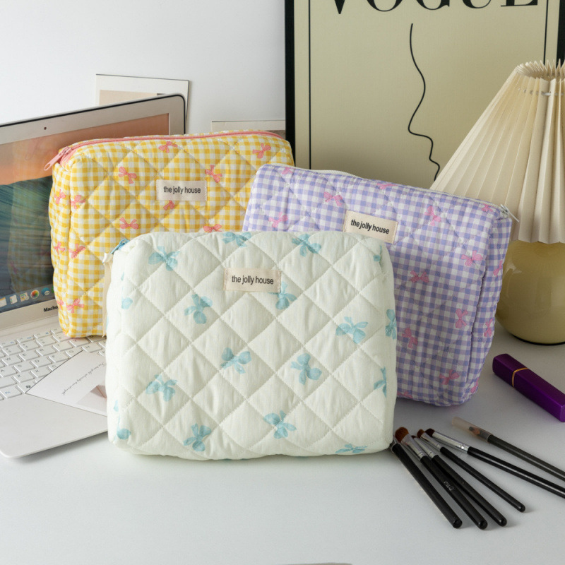 Capacious handheld cute cosmetic bag with bow for traveling