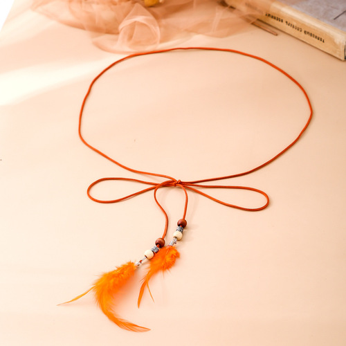 Ladies' fine Korean-style sash with a delicate fit, perfect for dresses and blouses. Features feather-tied waistband with tassels, Korean-inspired design.