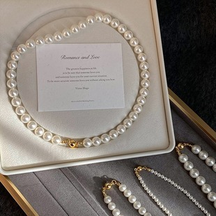 2024 New shijiaao white magnetic buckle round pearl necklace women's stacked sweater chain light luxury temperament neck chain