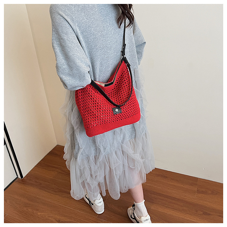 Summer hollowed-out knitted underarm bag for women, 2025 new style, laid-back and relaxed, seaside vacation style single-shoulder crossbody bag undefined