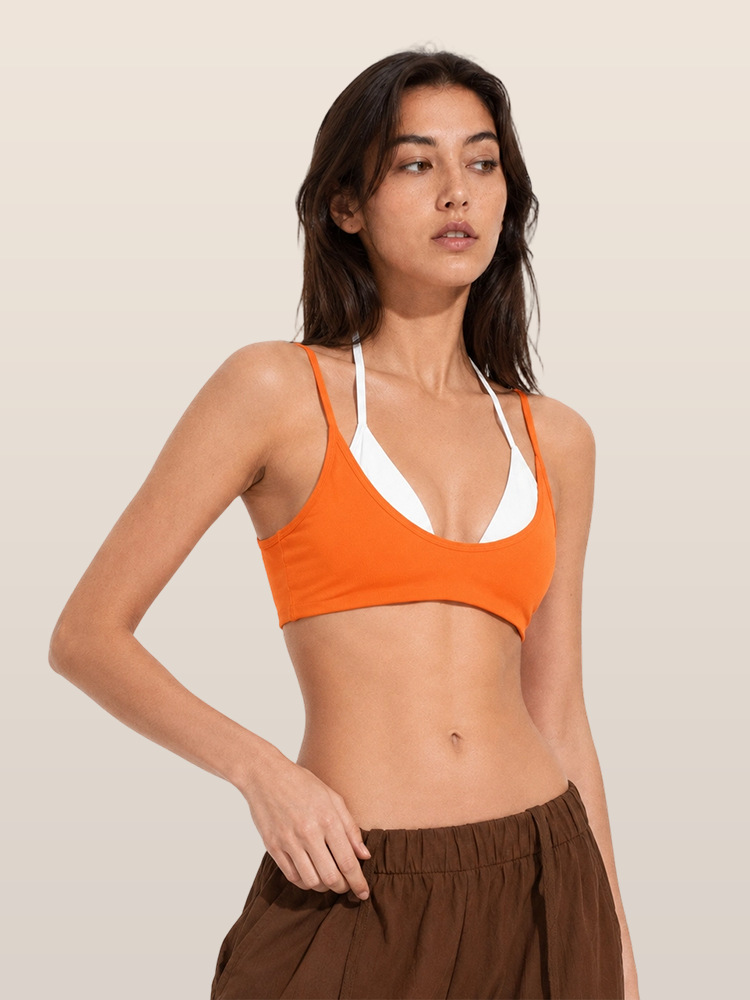 Europa y Estados Unidos de color transfronterizo falso empalme dos piezas chaleco deportivo cabina ropa de yoga hombro colgante cuello mujer con cojín de pecho