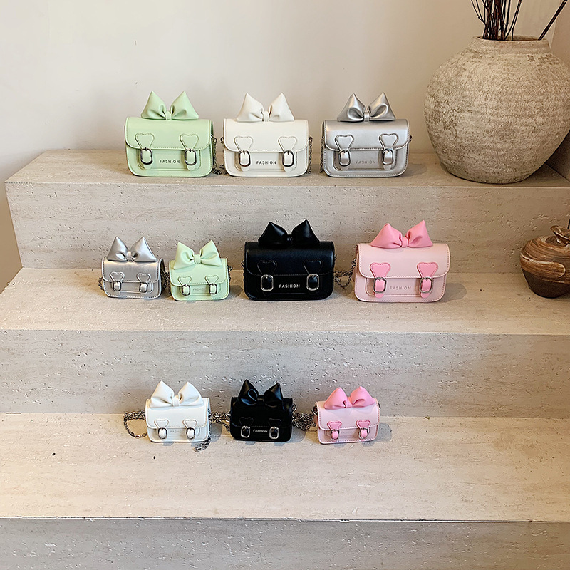 Versión coreana del bolso de hombro para niña con fragancia pequeña, bolso de mensajero para bebé con lazo lindo, bolso para niños con mini cadena de color sólido