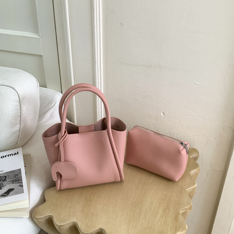 Bolso para mujeres 2026 nuevo estilo de moda bolso de cubo portátil de alta calidad lichi patrón popular lujo ligero mochila casual