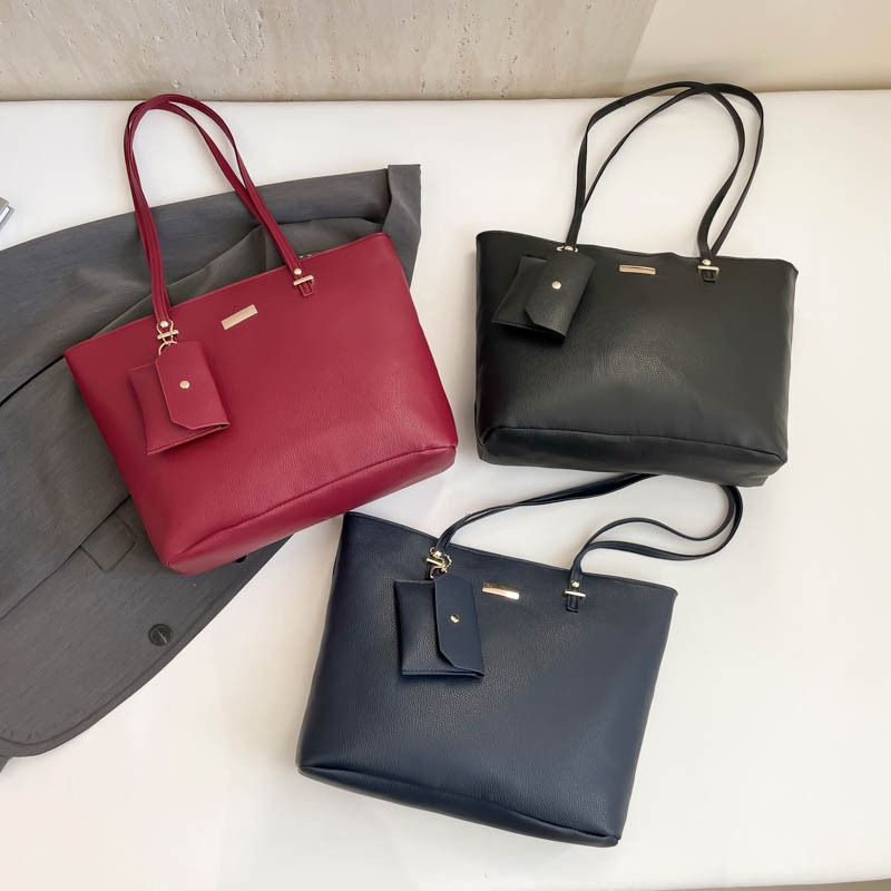 Bolsa de combinación de gran capacidad bolso de mujer 2025 primavera nueva moda simple textura mochila de hombro bolso de viaje de mujer