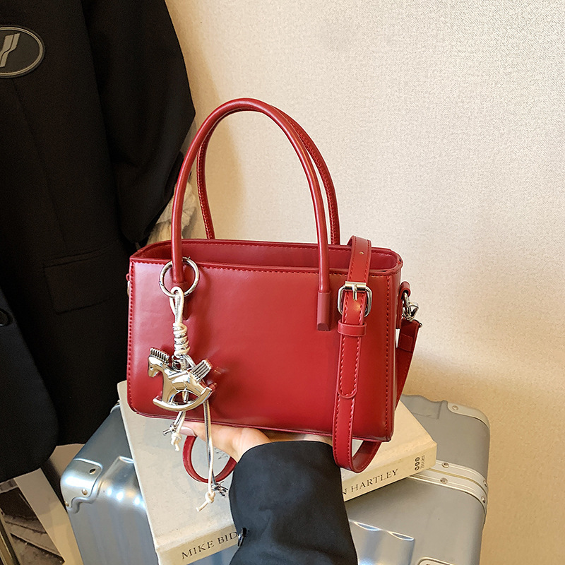 Diseño coreano de nicho bolso de mano casual para mujeres 2026 verano diario nuevo estilo de moda bolso de transporte