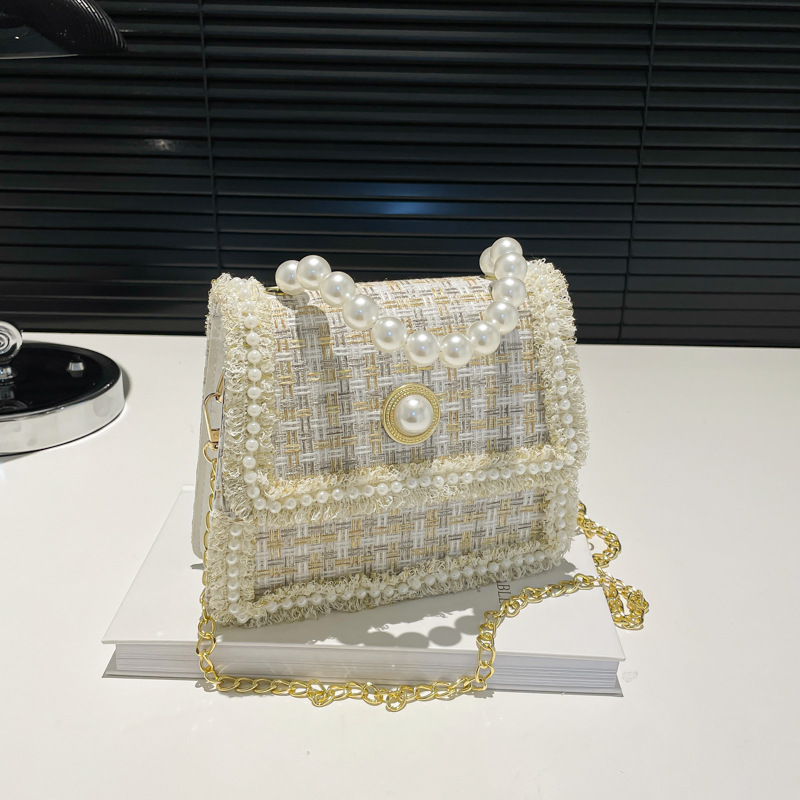 Bolso de tejido popular este año 2024 nuevo bolso pequeño de invierno para mujeres versátil nicho bolso de mochila temperamento