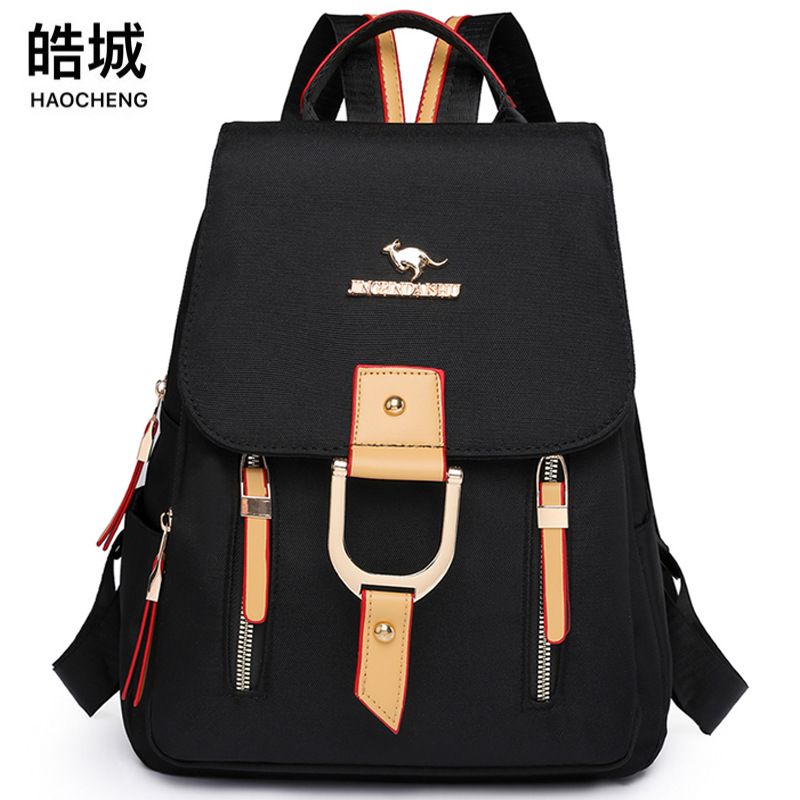 2024 nueva mochila de nailon para mujer de color de contraste tendencia de moda mochila de viaje ligera al por mayor al aire libre de gran capacidad