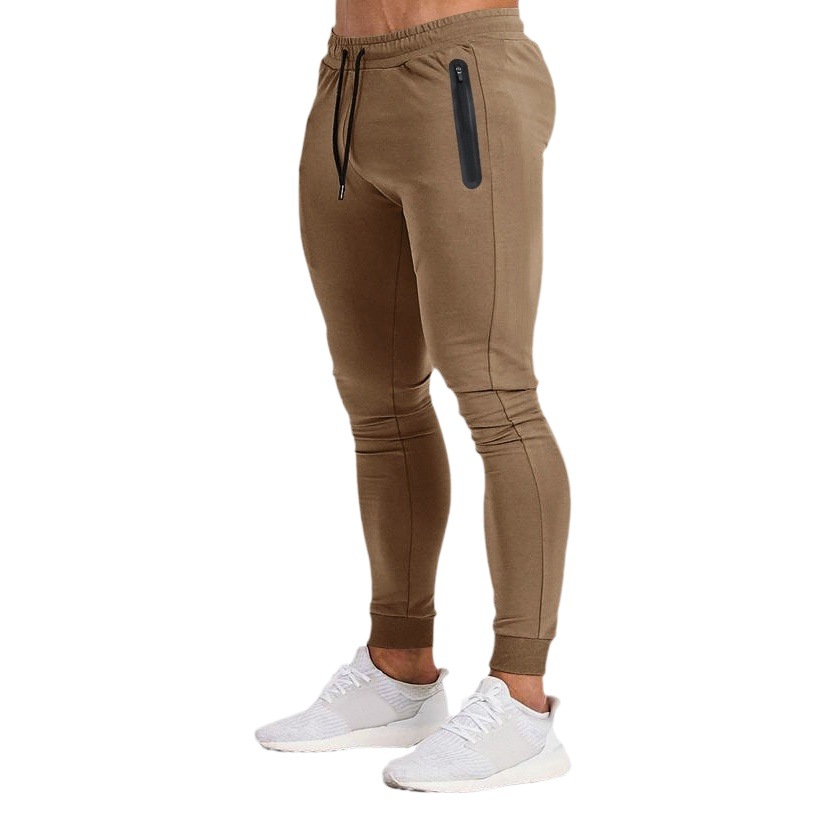 2023 Estación independiente transfronteriza europea y americana primavera y verano nueva versión ligera de color puro pantalones de fitness pantalones deportivos elásticos casuales moda masculina