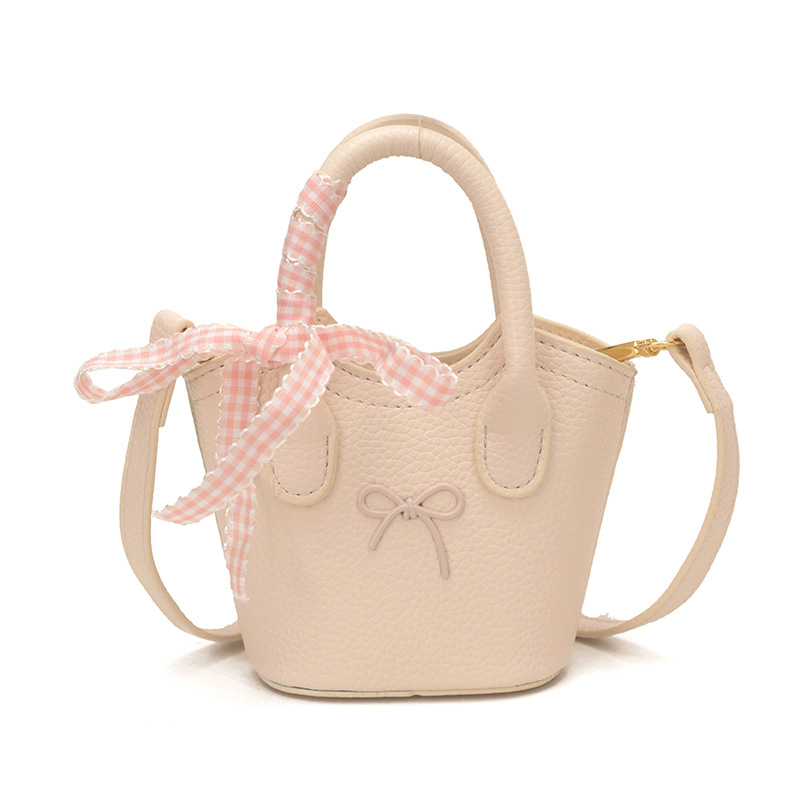 Nuevo bolso para niños coreano simple color sólido bolso de cubo para niños y niñas lindos arco mini bolso de mano bebé