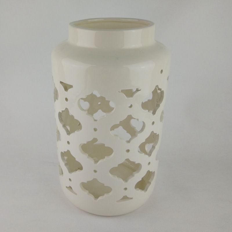 Moderno y simple cerámica nórdica LED linterna hueca vela candelabro decoración interior ligero de lujo lámpara de viento