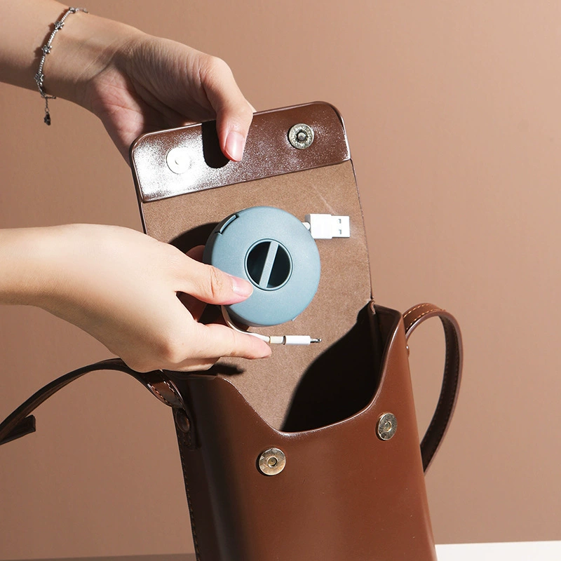 Small handheld portable round rotating storage box, mobile phone, charging cable