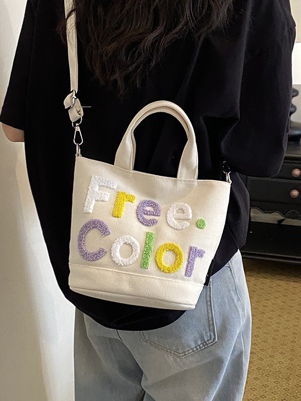Mamá bolso para salir bolso de cubo de mano mujer 2026 nuevo bolso de lona bordado de dibujos animados letras casuales bolso de mochila