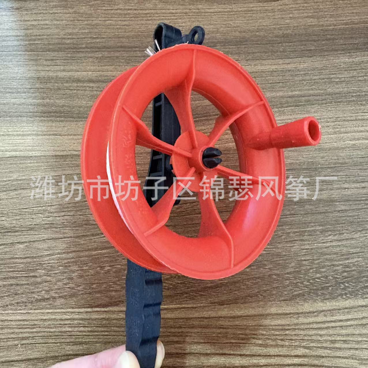 Roue rouge de 10cm + 30 m de ligne