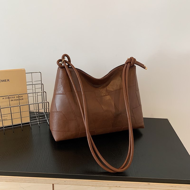 Retro de gran capacidad de moda de color sólido 2024 ocio simple nuevo estilo de estilo extranjero en la nueva bolsa de hombro portátil para mujeres