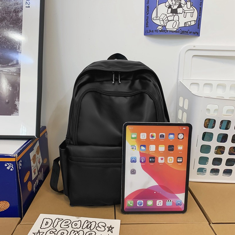 Comercio exterior nuevo estilo cuero suave gran capacidad color sólido escuela de secundaria mochila de moda masculina todo fósforo mochila simple japonesa