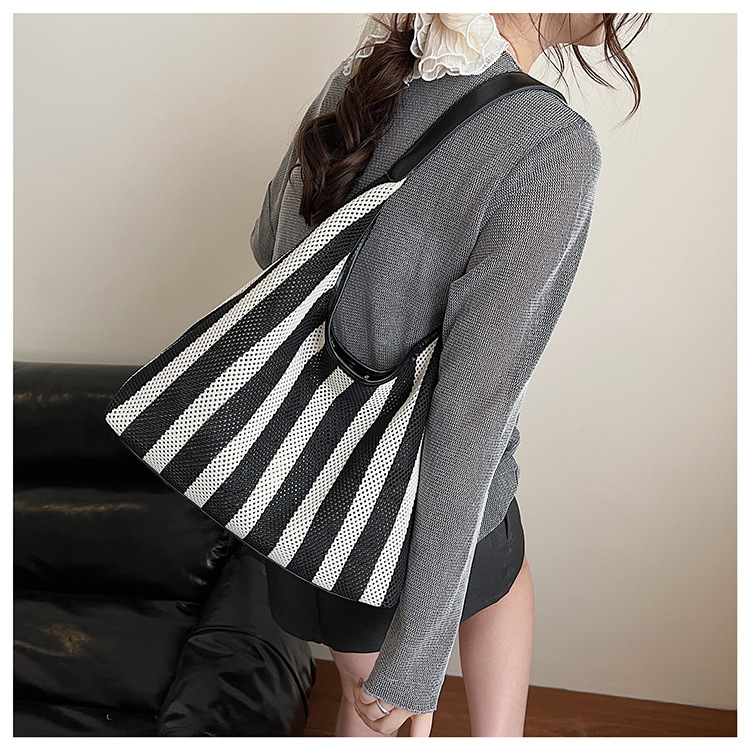 Korean summer new striped woven bag, casual vacation and laid-back style tote bag, hand and shoulder commuter tote bag undefined