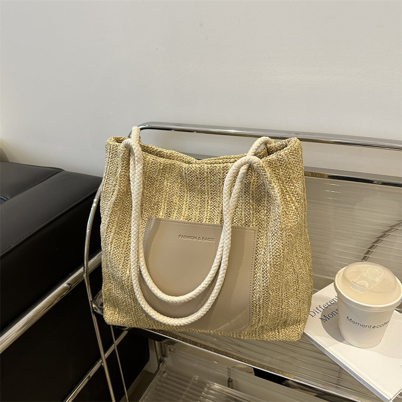 Popular bolsa de tejido de gran capacidad para mujeres 2024 verano nueva bolsa de hombro universal bolsa de viaje de moda