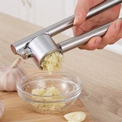 ニンニクの泥の器の手動のニンニクの器の家庭用のニンニクの器をむいてニンニクの泥を挟んで皮をむいてニンニクの蓉の器のステンレスのニンニクの器をつぶします。