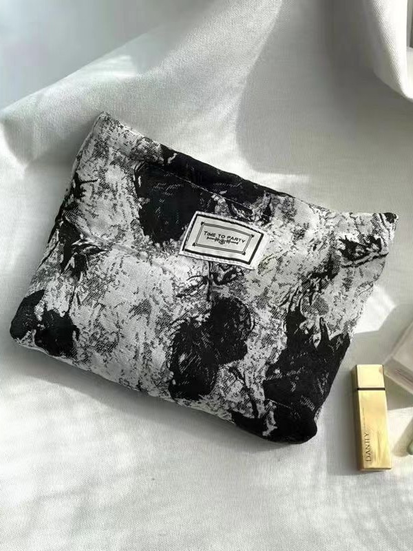 Diseño original de nicho blanco y negro temperamento Jacquard lienzo maquillaje bolsas de mano estilo retro simple flores convenientes