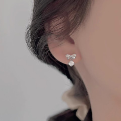 韓国版の精巧な蝶結びのイヤリングの女性の軽豪華なファッションの新型のフリンジジルコンのデザイン感の小さい大衆の耳飾りの卸売りの潮