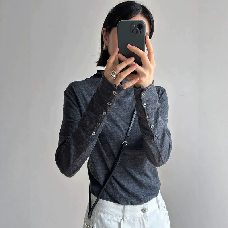 Women's fine-spun thin wool knit sweater with a semi-high collar, single-breasted back, slimming long sleeves, and a rolled collar design, perfect for early autumn Women's fine-spun thin wool knit sweater with a semi-high collar, single-breasted back, slimming long sleeves, and a rolled collar design, perfect for early autumn