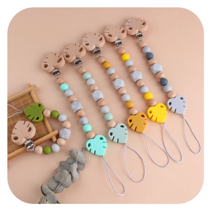 Suministros para bebés creativo clip de chupete de hoja de haya juguete mordedor bebé Cadena de chupete de hoja de silicona cadena anti-caída