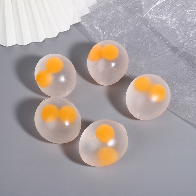 Whimsical stress-relief toy: Transparent Double-Yolk Egg Fidget Ball – Hand-Squeeze, Creative Poppin' Fun! Perfect for Night Market Stalls or Street Vending Stands to Unwind and De-stress.