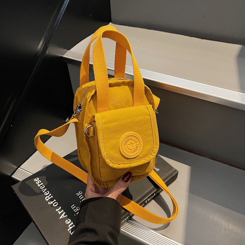 Cross-border foreign trade 2025 new mini nylon cloth hand bag female Korean mother bag shoulder diagonal bag wholesale Cross-border foreign trade 2025 new mini nylon cloth hand bag female Korean mother bag shoulder diagonal bag wholesale