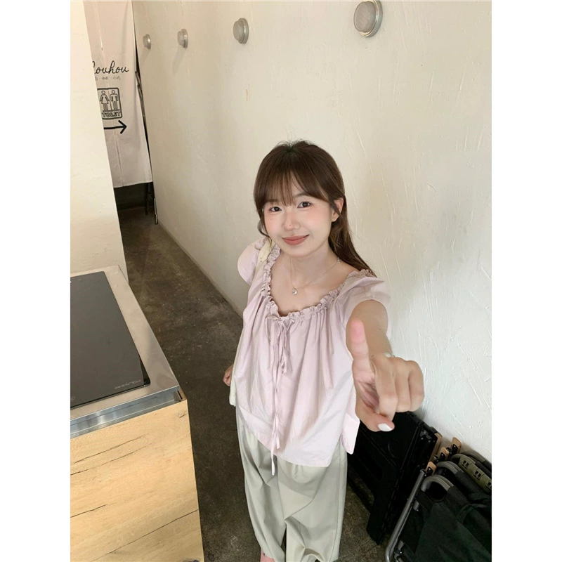 Летний костюм для женщин, уменьшающий возраст, новый корейский стиль 2025 года, свободная рубашка с коротким рукавом на шнуровке + широкие брюки, комплект из двух предметов