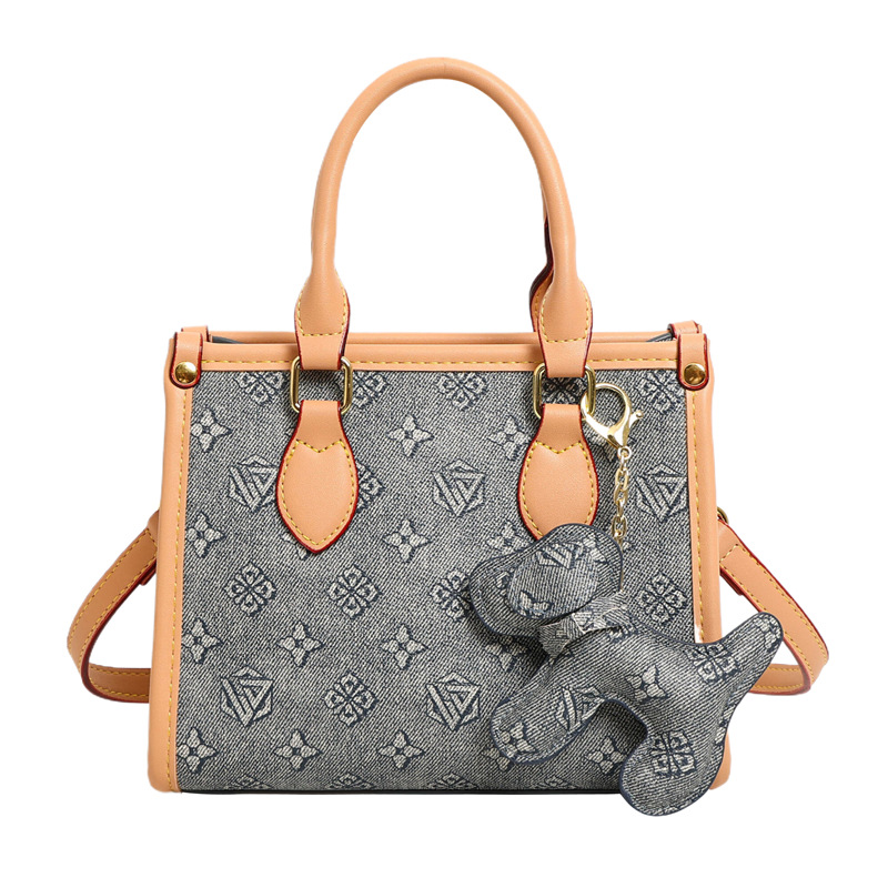 Bolsos clásicos de presbiterio con estampado de letras Bolsos tote Bolsos retro europeos y americanos al por mayor transfronterizos Bolsos de hombro con textura de todo fósforo