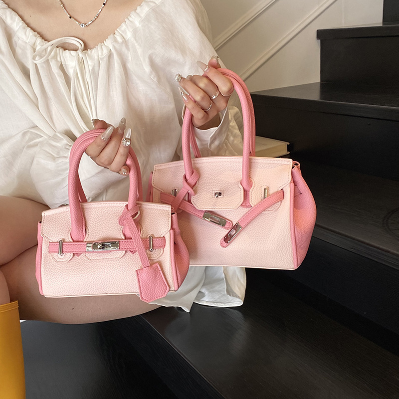 Bolso portátil de platino con textura de moda transfronteriza, bolso de hombro simple y versátil de lujo ligero, bolso de nicho de temperamento de gran capacidad