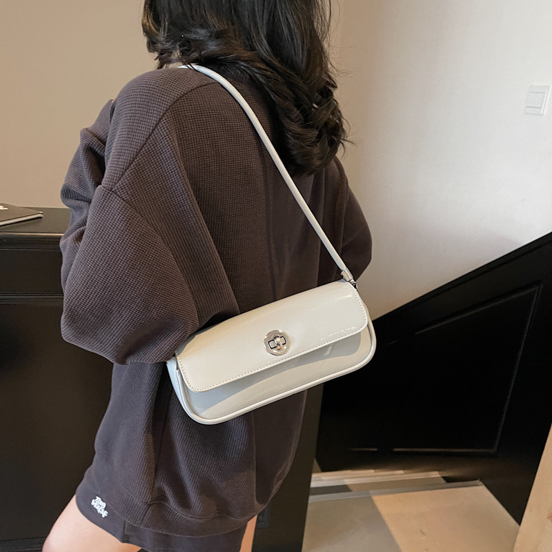 Bolso de axila de textura de alta calidad 2025 primavera nuevo bolso femenino charol brillante bolso de hombro fresco simple