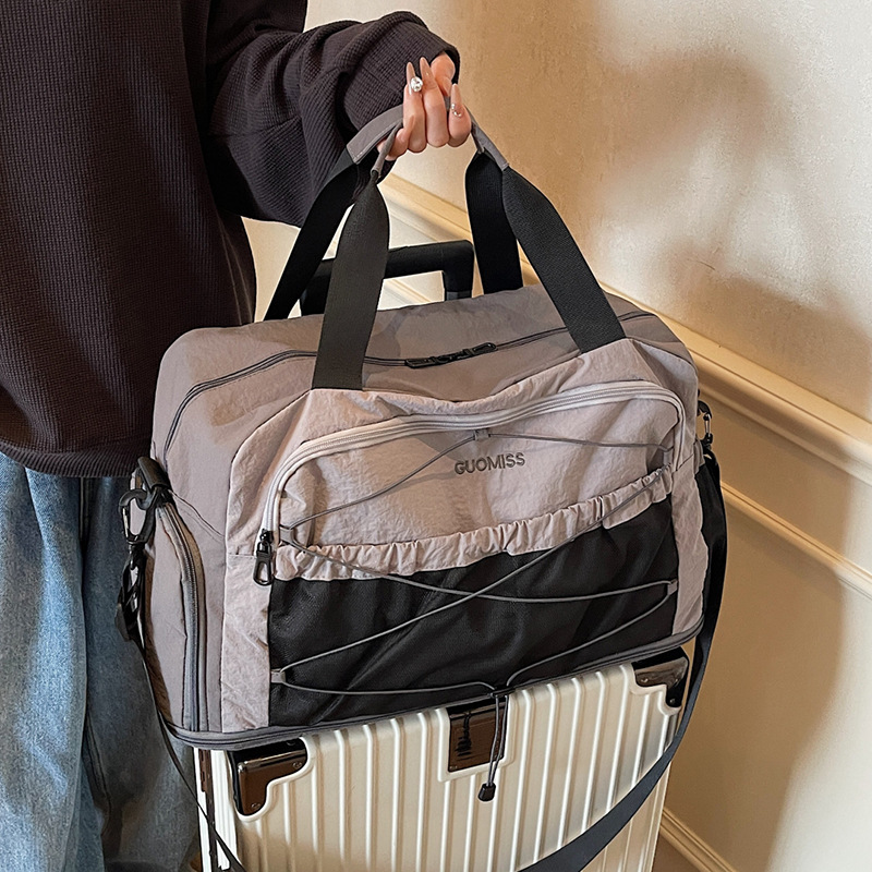Nicho de diseño de moda moda moda bolsa de mano de mujer gran capacidad bolsa de viaje corto bolsa de almacenamiento bolsa de viaje deportiva al aire libre