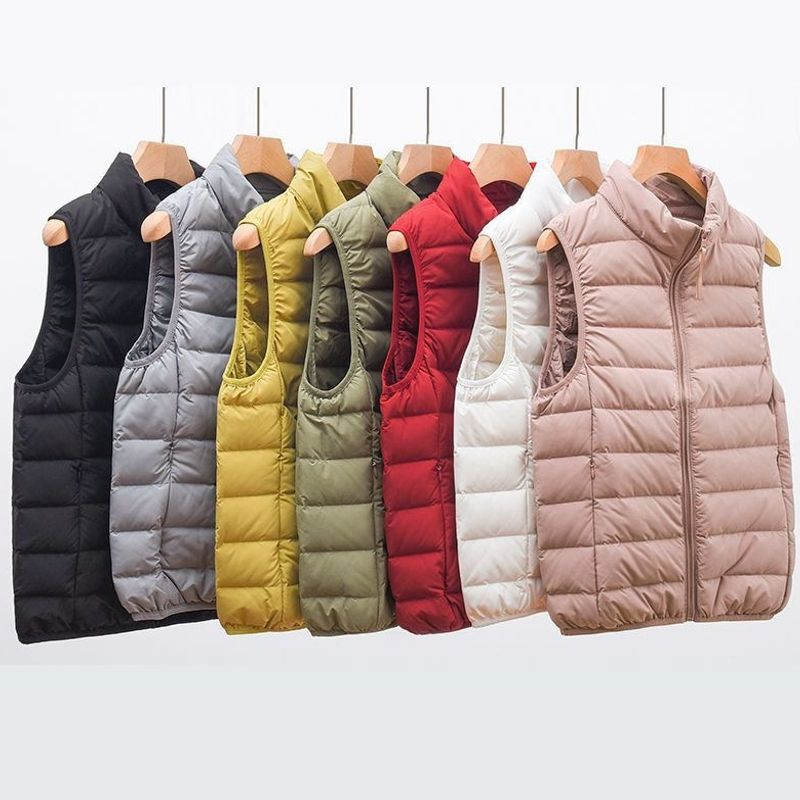New lightweight down-filled vest for women, short style, with a stand-up collar, seamless design, and lightweight construction New lightweight down-filled vest for women, short style, with a stand-up collar, seamless design, and lightweight construction