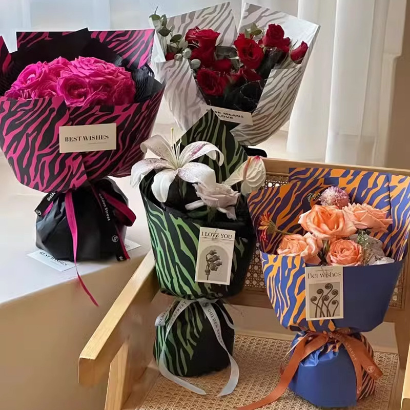 Fábrica de fiestas de flores al por mayor leopardo transfronterizo papel de embalaje de flores nuevo ramo de flores papel de embalaje de regalos florista