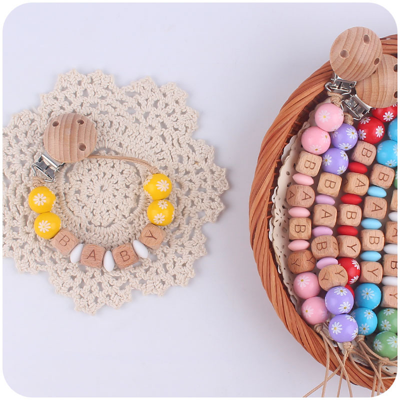 Nuevo bebé suministros dibujos animados madera Margarita cuentas pacificar bebé DIY nombre chupete cadena anti-gota cadena